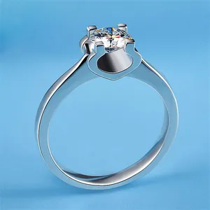 Detailed view of a sparkling round-cut zircon ring with a modern four-prong silver setting.