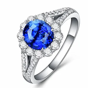 Close-up detail of silver halo ring with a brilliant blue center stone