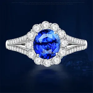 Elegant silver-plated ring with a large oval blue zircon and sparkling halo stones.