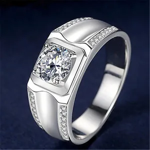 Detailed close-up of a silver men's ring featuring a large sparkling zircon stone.