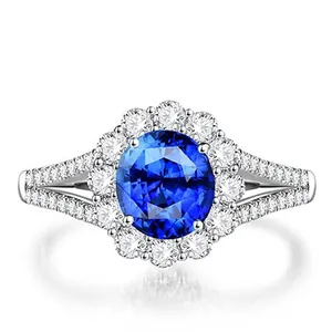 Elegant silver wedding ring with oval blue zircon center and brilliant crystal halo