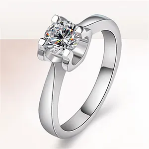 Elegant silver-colored engagement ring featuring a large brilliant round-cut zircon stone