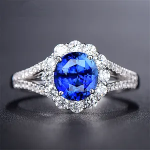 Elegant silver-plated wedding ring with a stunning oval blue sapphire-like stone