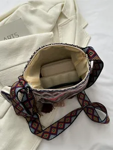 Large capacity ethnic style shoulder bag with tassels and colorful geometric strap
