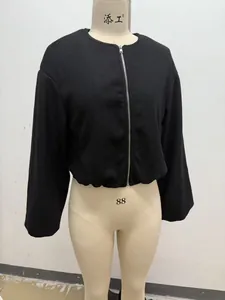 Classic black soft-textured women's bomber jacket with front zipper on a display mannequin