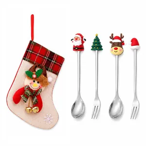 Festive Christmas cutlery set including spoons, forks, and decorative holiday stocking