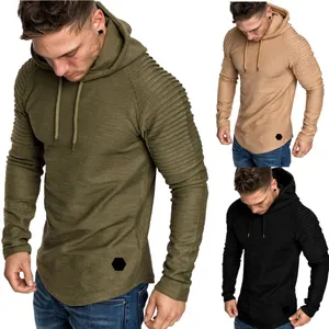 Detailed view of men's hooded sweatshirt with unique pleated sleeves and curved hem.