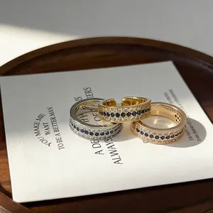 Close-up detail of luxury vintage rings with sapphire and clear crystal pavé setting in gold