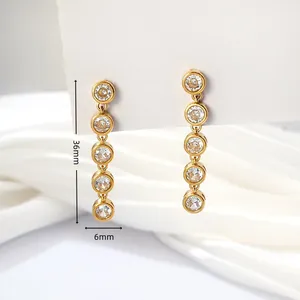 Close-up of gold stainless steel long drop earrings with five round crystals and dimensions.