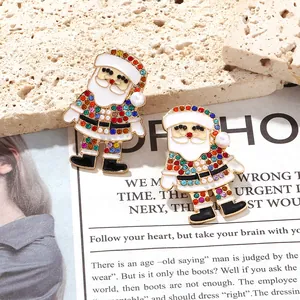Detailed macro view of colorful rhinestone Santa Claus enamel festive drop earrings