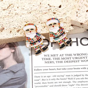 Detailed view of colorful rhinestone Santa Claus earrings with enamel finish