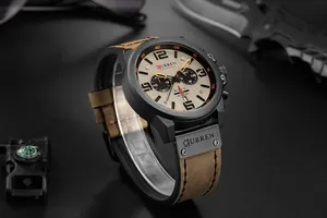 Close-up of CURREN men's tactical chronograph watch with brown leather strap