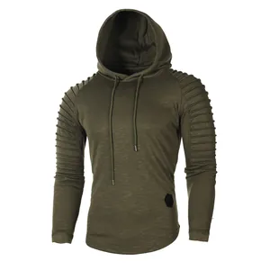 Detailed view of men's olive green hoodie with pleated raglan sleeves