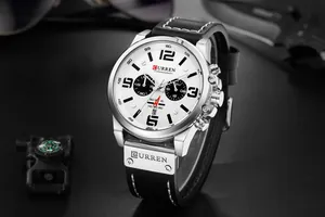 Close-up of CURREN men's business quartz watch with white dial and black leather strap.