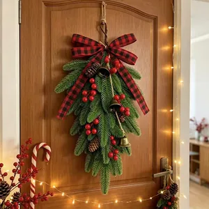 Festive Christmas teardrop swag with buffalo plaid bow and vintage bells for door decor