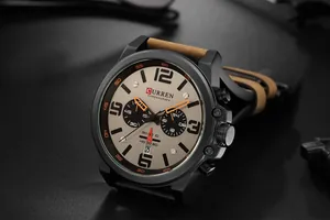 Close-up detail of CURREN 8314 men's quartz chronograph watch with brown leather strap