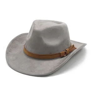 Macro detail of grey suede cowboy hat showing the brown decorative band and tassel buckle