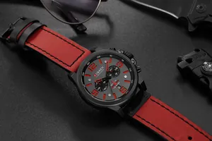 Detail view of CURREN 8314 men's chronograph watch with red leather strap and tactical gear.