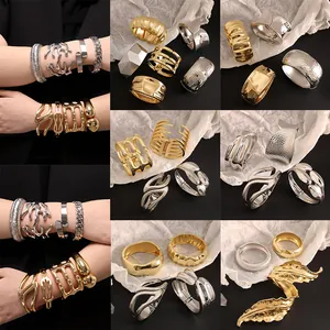 Elegantes brazaletes de aleación irregulares en oro y plata para el brazo mujer tendencia