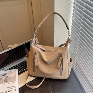 Textured beige hobo crossbody bag for women, perfect for commuting and students.