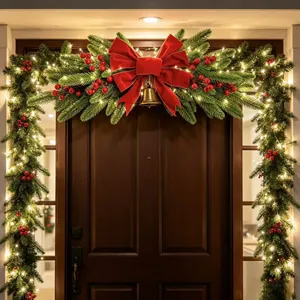 Festive Christmas door garland featuring a red bow, gold bell, and warm LED lights