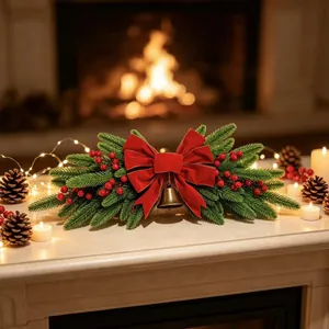Festive Christmas swag with red bow and gold bell displayed on a fireplace mantel.