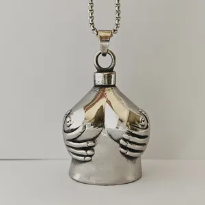 Detailed view of artistic female torso guardian bell with stainless steel chain link
