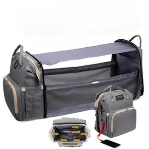 Multifunctional diaper bag with expandable portable baby crib bassinet and sunshade detail