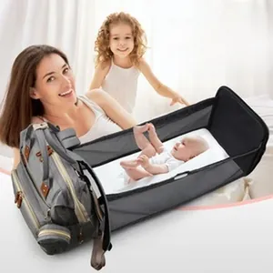 Detailed view of the multifunctional mummy bag expanded into a portable baby crib.