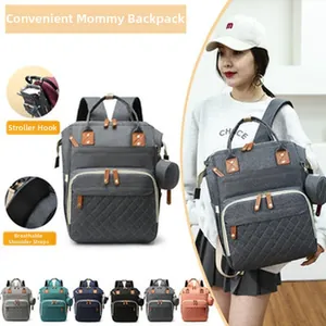 Versatile gray diaper backpack featuring convenient stroller hooks and breathable straps