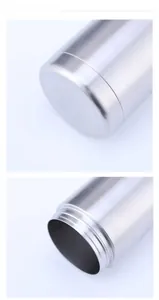 Close-up detail of stainless steel can cooler showing bottom and threaded opening