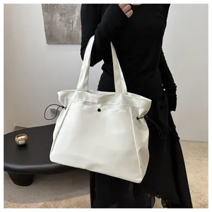 Large capacity white tote bag with drawstring detail for women's daily commute