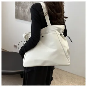 Large capacity white tote bag shown on model back view for daily commuting style