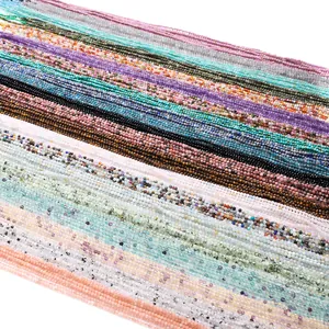 Macro detail of 2-2.5mm faceted natural stone beads in diverse colors for DIY jewelry
