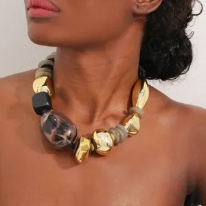 Detailed view of bohemian leopard print chunky necklace with metallic gold beads
