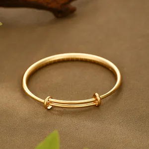 Detailed view of an ancient method sand gold adjustable push-pull bangle bracelet