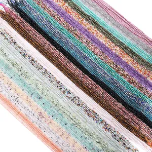 Close-up detail of 2-2.5mm faceted natural stone beads for DIY jewelry making.