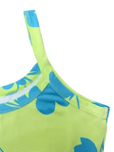 Detailed macro view of vibrant green dress strap with blue heart pattern stitching