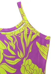 Close-up of a summer slim fit dress with vibrant purple and neon green tropical leaf print details