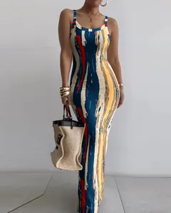 Detailed shot of slim-fit maxi dress featuring a colorful abstract art print