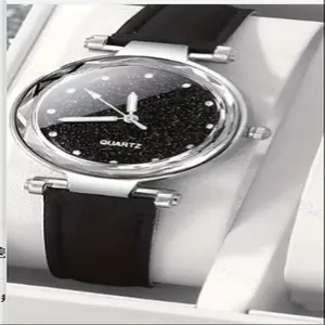 Close-up of women's quartz watch with black starry sky dial and matte strap