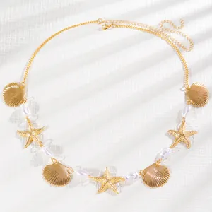 Chaîne de taille dorée bohème avec breloques coquillages, étoiles de mer et perles
