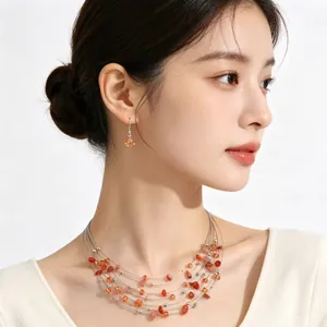 Bohemian multi-layered necklace and earrings set with natural orange crushed stones