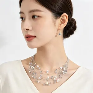 Elegant Bohemian multi-layer gravel necklace and earring set worn by a model