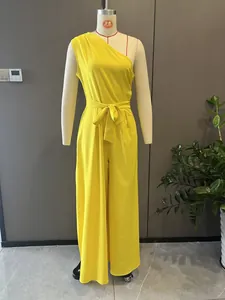 Vibrant yellow one-shoulder wide-leg jumpsuit with elegant waist tie detail on mannequin