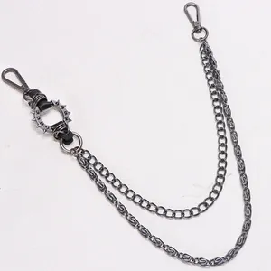 Detailed macro view of a punk rock double-layer metal waist chain with sharp silver spikes