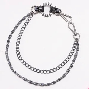 Detailed view of punk metal double layered trousers chain with spiked ring accent