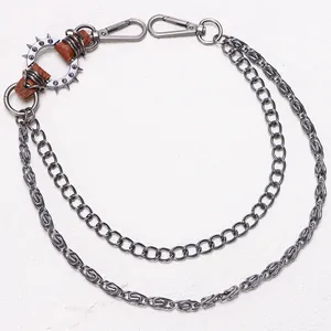 Detailed view of punk metal pants chain with spikes and double layered links for men