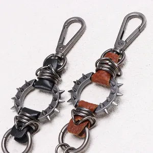 Detailed view of heavy metal punk rock spiked pants chain with rings and leather straps