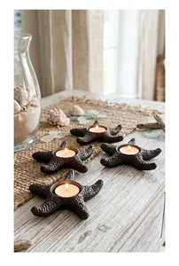 Rustic cast iron starfish tea light holders set for nautical themed home decor